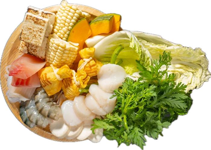 Cabbage, corn, tofu, greens and seafood for the pot