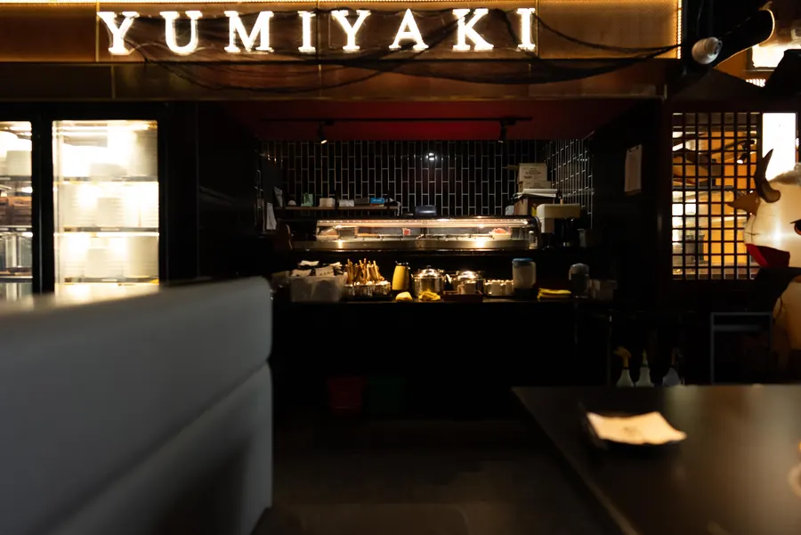 The dining room under the illuminated Yumiyaki sign