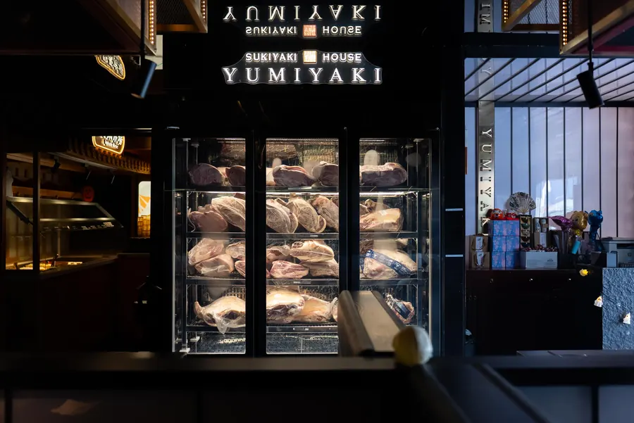 The wagyu cabinet beneath the Yumiyaki sign